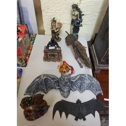 373 - A COLLECTION OF MISC. FIGURINES INC. POSABLE ANIMAL FIGURE, BATS ETC.