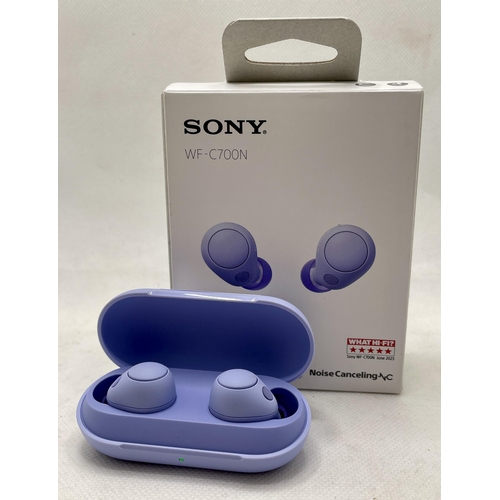 9 - BOXED PAIR OF SONY WF-C700N WIRELESS EAR BUDS IN CHARGING CASE IN LAVENDER