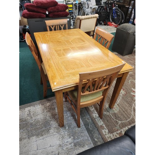 303 - A MODERN CROSSBANDED INLAID DINING SUITE COMPRISING -A RECTANGULAR LIGHT/GOLDEN OAK DINING TABLE - O... 