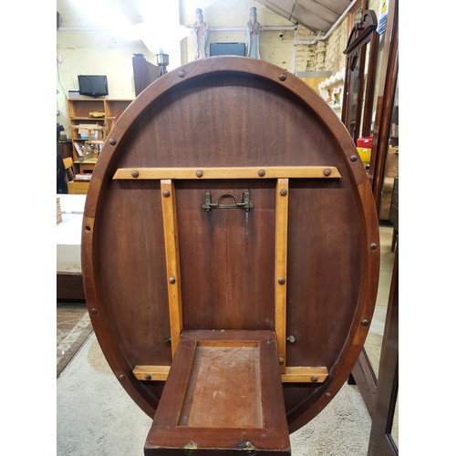 294 - A VICTORIAN FIGURED BURR WALNUT OVAL TILT TOP LOO TABLE RAISED ON FOUR TURNED SUPPORTS AND FOUR CARV... 