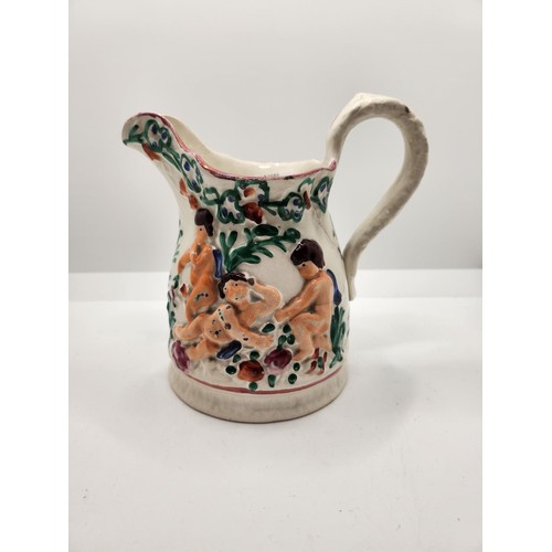 422 - VICTORIAN STAFFORDSHIRE JUG IN THE MANNER OF SWANSEA POTTERY DESIGNED WITH RECLINING CHERUBS C.1850