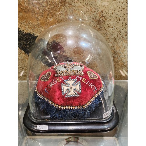 408 - NAVAL 'FORGET ME NOT' SWEET HEART PIN CUSHION ON SQUARE EBONIZED BASE WIHT SQUARE GLASS DOME