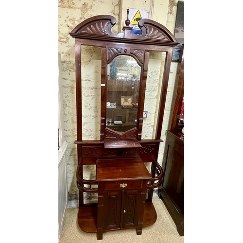 305 - EDWARDIAN STYLE MAHOGANY CARVED HALL STAND. CENTRAL MIRROR ABOVE A SINGLE DRAWER WITH CABINET BELOW ... 