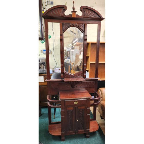 305 - EDWARDIAN STYLE MAHOGANY CARVED HALL STAND. CENTRAL MIRROR ABOVE A SINGLE DRAWER WITH CABINET BELOW ... 