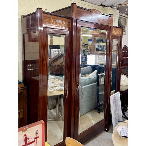 304 - AUSTRIAN ART NOUVEAU MAHOGANY FRUIT WOOD AND MOTHER OF PEARL INLAY TRIO MIRRORED WARDROBE, A LARGE M... 