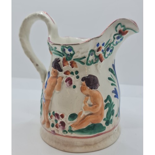 375 - VICTORIAN STAFFORDSHIRE JUG IN THE MANNER OF SWANSEA POTTERY DESIGNED WITH RECLINING CHERUBS C.1850