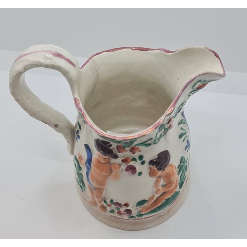 375 - VICTORIAN STAFFORDSHIRE JUG IN THE MANNER OF SWANSEA POTTERY DESIGNED WITH RECLINING CHERUBS C.1850