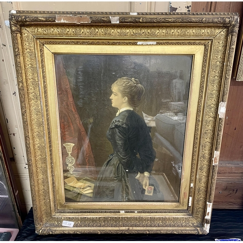 390 - LARGE GILT FRAMED OLEOGRAPH OF A VICTORIAN LADY HOLDING A CARD - HEAVY GILT FRAME, SOME CHIPS