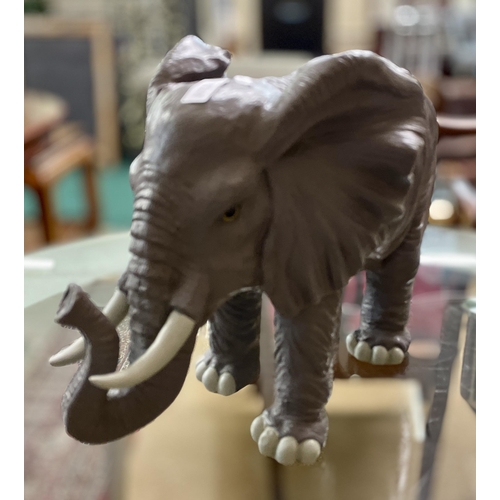 226 - A RESIN ELEPHANT FIGURE 36X42CMS
