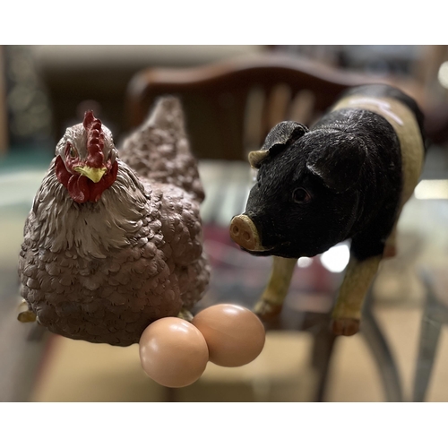 228 - A LARGE RESIN HEN FIGURE WITH EGG And AN 'OINK' RESIN PIG FIGURE