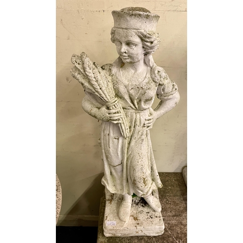 268 - A STONEWARE GARDEN STATUE - FEMALE FIGURE HOLDING A SHEAF OF WHEAT -APPROX H:78CMS