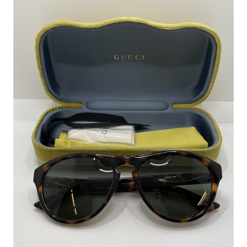 27 - PAIR OF GUCCI SUNGLASSES GG0747S WITH GUCCI GREEN VELVET CASE