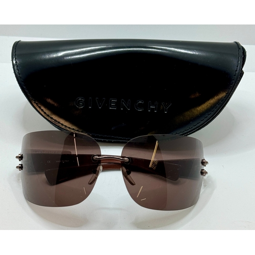 61 - PAIR OF GIVENCHY WRAPAROUND SUNGLASSES - SGV123 - WITH GIVENCHY CASE