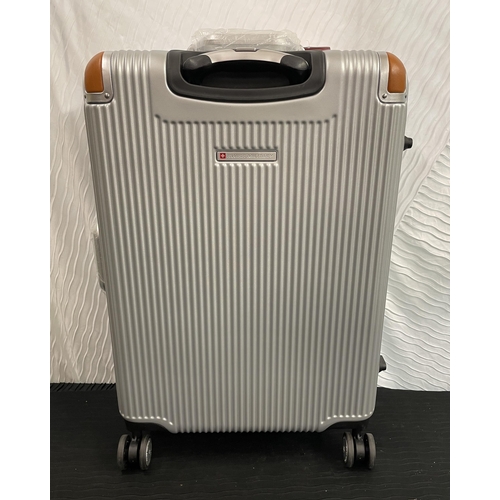 238 - LARGE HARDSIDE SWISS MILITARY SPINNER SUITCASE WITH DOUBLE CLASP LOCK IN SILVER