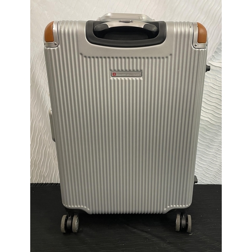 239 - LARGE HARDSIDE SWISS MILITARY SPINNER SUITCASE WITH DOUBLE CLASP LOCK IN SILVER