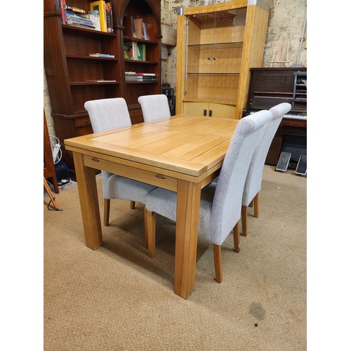 292 - OAK FURNITURE LAND SOLID NATURAL OAK EXTENDING DINING TABLE AND A SET OF 4 DINING CHAIRS