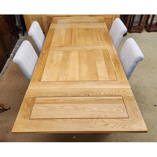 292 - OAK FURNITURE LAND SOLID NATURAL OAK EXTENDING DINING TABLE AND A SET OF 4 DINING CHAIRS