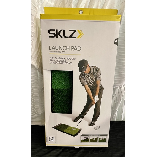 43 - BOXED SKLZ THREE IN ONE GOLF LAUNCH PAD - CREASE IN GRASS