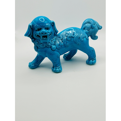 374 - CHINESE: A 20TH C. CHINESE TURQUOISE BUDDHISTIC LION - 15.5CMS (L)