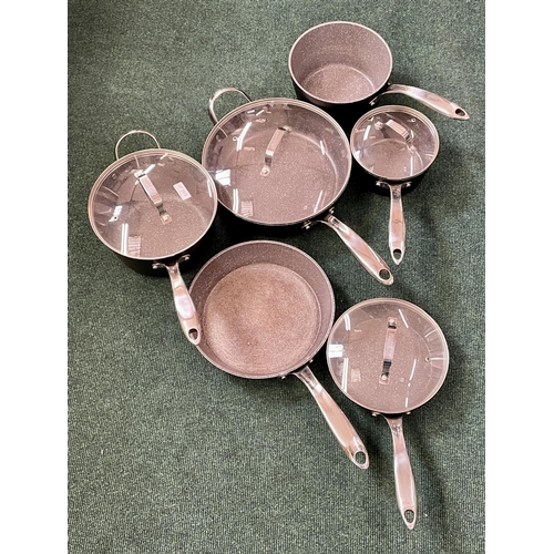 107 - STARFRIT THE ROCK 10 PIECE PAN SET - SLIGHT PREVIOUS USEAGE - 6 PANS/4 LIDS