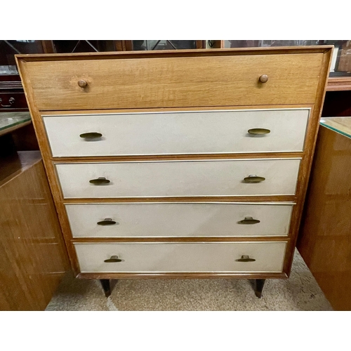 266 - A TEAK AND CREAM REXINE FRONTED WRIGHTON CHEST OF FIVE DRAWERS ON RAISED EBONISED LEGS