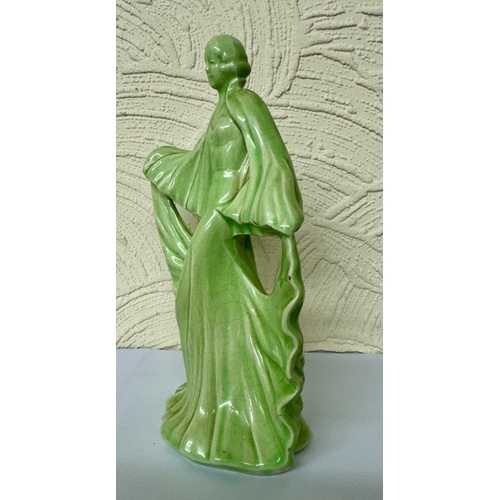 362 - A PALE GREEN GLAZED CERAMIC ART DECO DANCING FIGURE H.22CM NB: SMALL CHIP TO BASE AT BACK