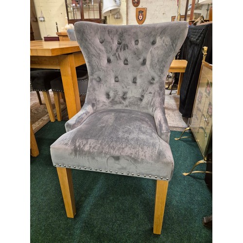 249 - A SET OF 4 OAK FURNITURE LAND GREY VELVET BUTTON BACK UPHOLSTERED DINING CHAIRS WITH STUDDED TRIM AN... 