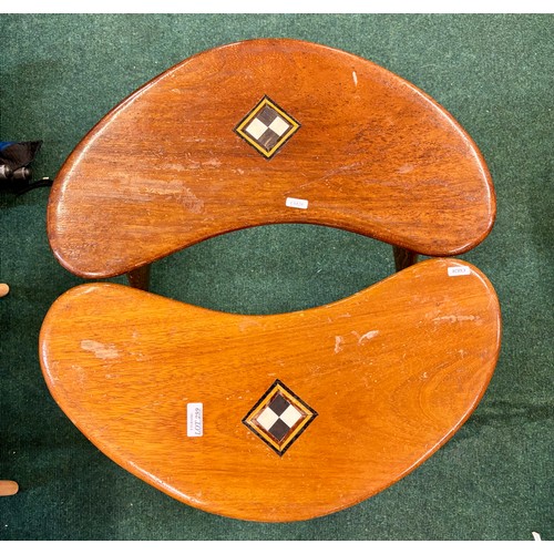 299 - A PAIR OF TEAK VINTAGE TRIPOD BOOMERANG SIDE TABLES WITH BLACK AND WHITE SQUARE INLAY TO TOP