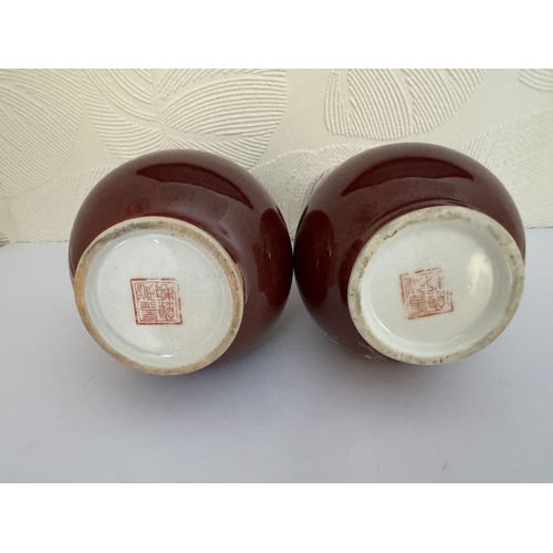 367 - A PAIR OF CHINESE RED GLAZED PORCELAIN VASES - RED SEAL MARK TO BASES H:22CMS