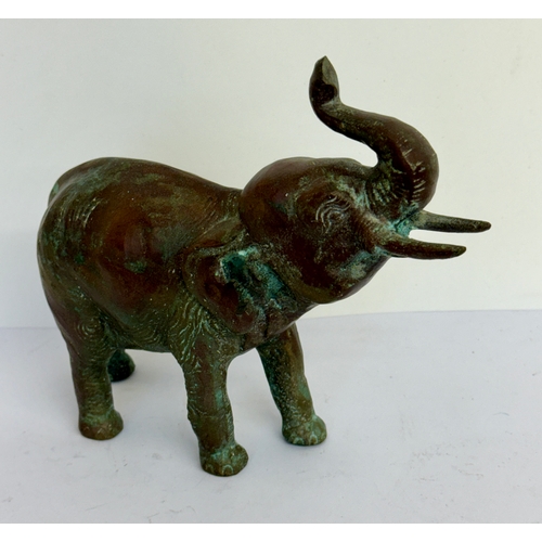 380 - A HEAVY BRONZE ELEPHANT FIGURE - TRUNK RAISED AND BELLOWING -SOUTH ASIAN, APPROX 18CMS LONG AND 1150... 