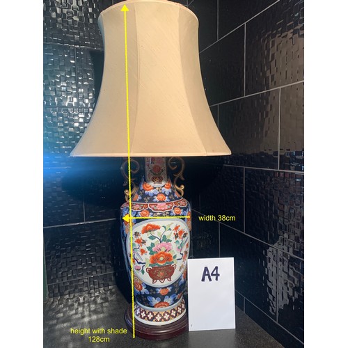 295 - A LARGE CHINESE LAMP & SHADE -PEONY & ROYAL BLUE GROUND PATTERN WITH ORNATE GILDED HANDLES - ON WOOD... 