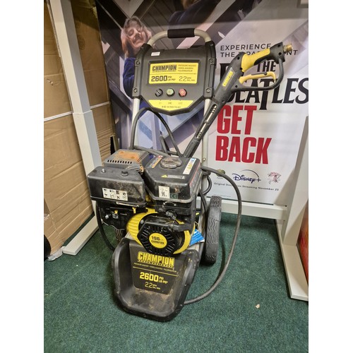 223 - CHAMPION 2600 PSI PETROL PRESSURE WASHER WITH LANCE/HOSE/NOZZLES - NB: PULLEY FAULT AND PREVIOUS USE... 