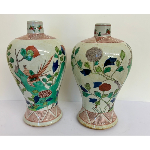 319 - A HEAVY PAIR OF FAMILLE VERTE ROUND NECK PLUM VASES ON UNGLAZED BASES DECORATED IN FLORA FAUNE AND B... 