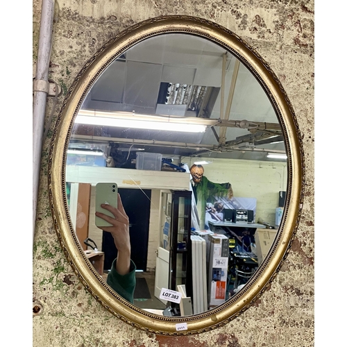 383 - GILT OVAL FRAMED MIRROR