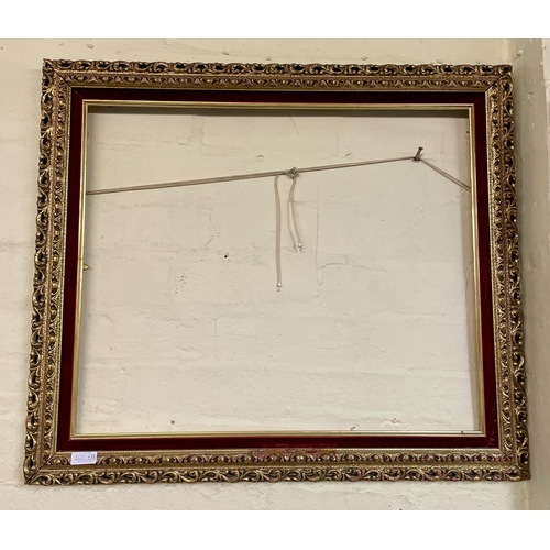 431 - GILT AND RED VELVET ROCCOCO STYLE FRAME  - APPROX 74CM X 65CM