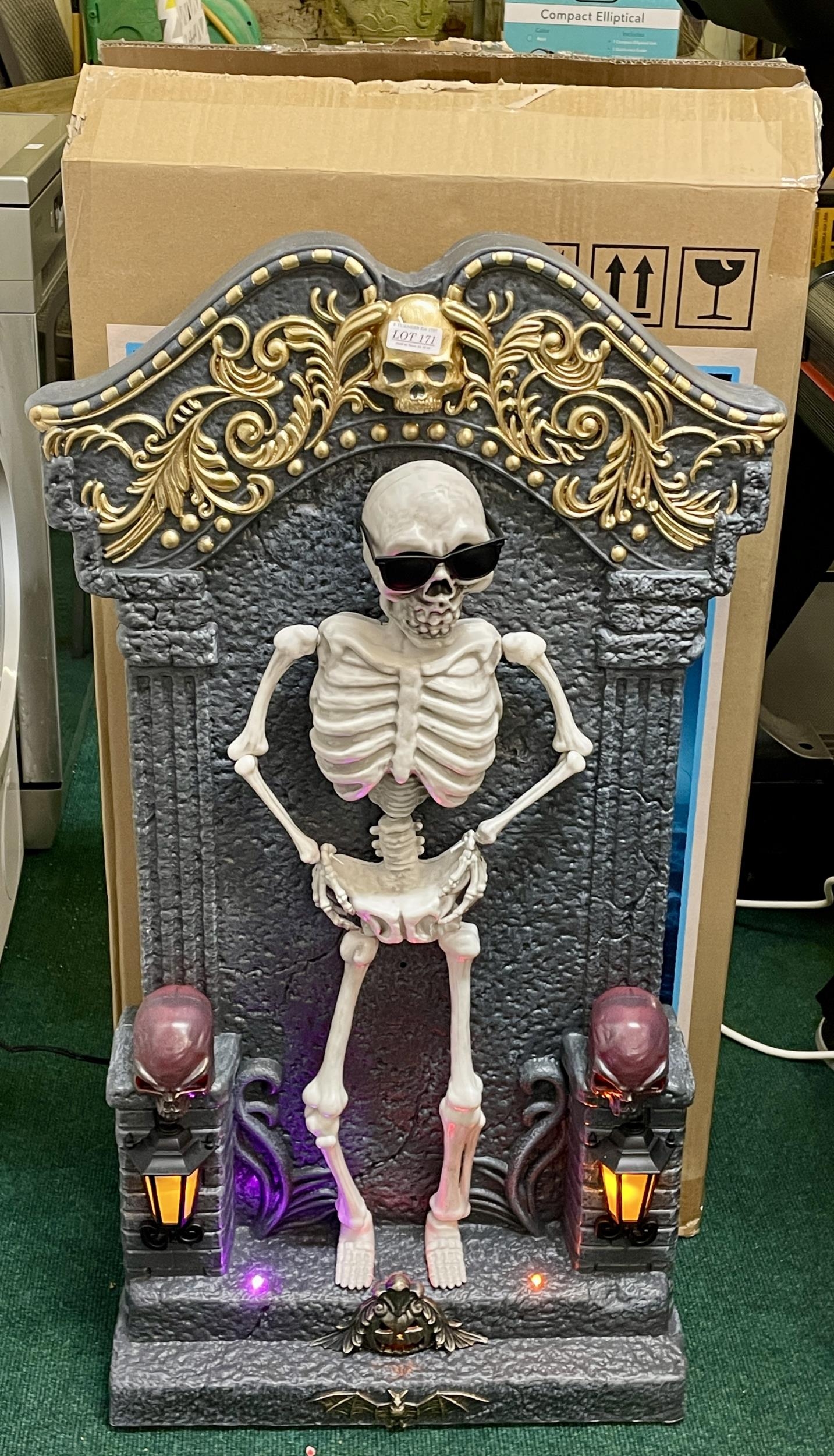 BOXED TOMBSTONE WITH LED LIGHTS AND MUSIC (DOES NOT MOVE AND MOTOR IS LOUD)