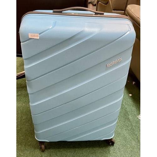 189 - LARGE AMERICAN TOURISTER HARD SIDE SPINNER SUITCASE IN SKY BLUE