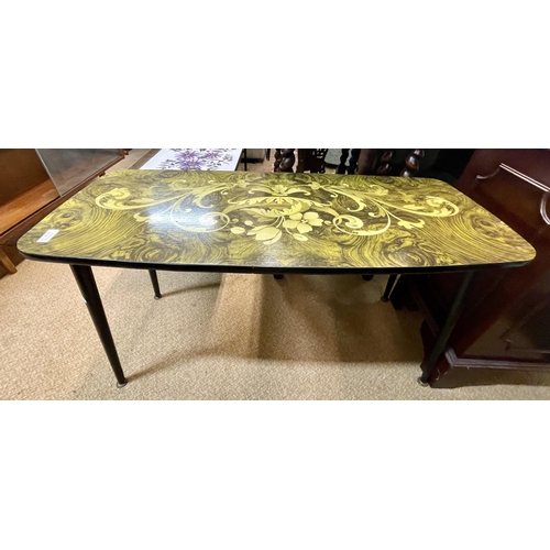 259 - A MID-CENTURY FLORAL FORMICA TOP COFFEE TABLE IN BLACK AND YELLOW SHOWING A FLORAL BOWL WITH FLOWERS... 