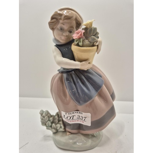 337 - A LLADRO FIGURE OF A GIRL WITH A SCARF HOLDING A PLANT POT - NB ONE FLOWER HEAD MISSING