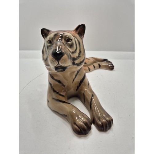 339 - A RECLINING TIGER FIGURE - MARKED TO BASE WR MIDWINTER LTD BURSLEM