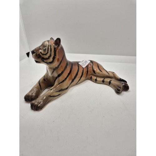 339 - A RECLINING TIGER FIGURE - MARKED TO BASE WR MIDWINTER LTD BURSLEM