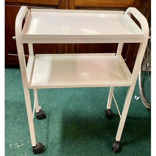 461 - A WHITE ENAMELLED THREE TIER WHEELED TROLLEY