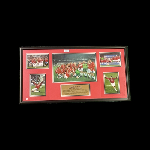 411 - A FRAMED MANCHESTER UNITED TREBLE TROPHY WINNERS PHOTO COLLAGE