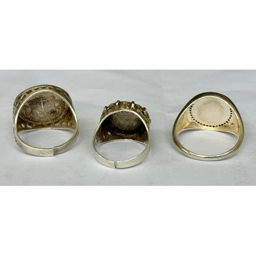 379 - THREE VINTAGE SILVER RING  - TWO BASKET RINGS WITH ST GEORGE COINS THE THIRD A SILVER BASKET SHANK W... 