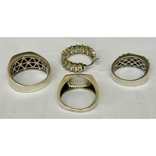 380 - THREE SILVER RINGS AND A SINGLE SILVER EARRING -TWO SIGNET STYLE RING WITH CZ'S AND THE THIRD BEARIN... 