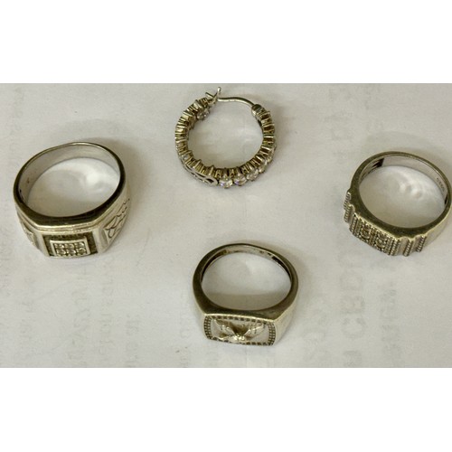 380 - THREE SILVER RINGS AND A SINGLE SILVER EARRING -TWO SIGNET STYLE RING WITH CZ'S AND THE THIRD BEARIN... 