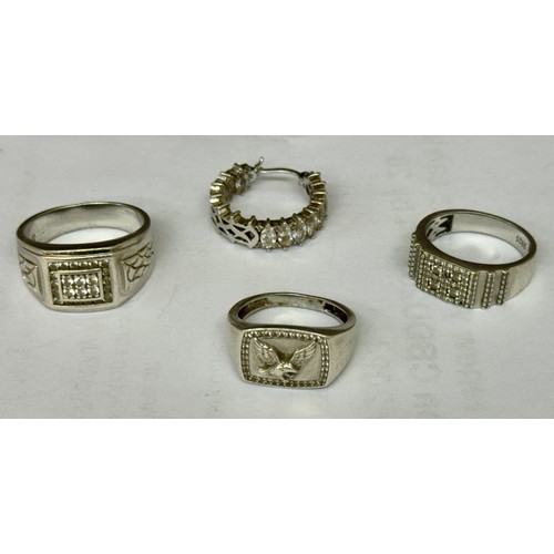 380 - THREE SILVER RINGS AND A SINGLE SILVER EARRING -TWO SIGNET STYLE RING WITH CZ'S AND THE THIRD BEARIN... 