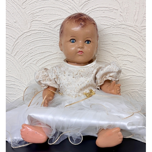 411 - A VINTAGE COMPOSITE DOLL - WITH HARDSHELL BODY, LEGS AND ARMS, BLUE EYES - IN LATER DRESS H: 50CMS/2... 