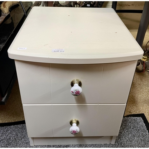 313 - A WHITE VENEERED BOW FRONT CHEST OF TWO DRAWERS, BEDSIDE CABINET TYPE, WITH PORCELAIN FLORAL KNOBS A... 