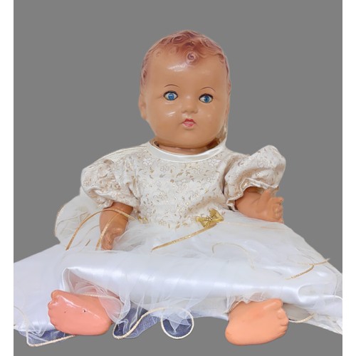 411 - A VINTAGE COMPOSITE DOLL - WITH HARDSHELL BODY, LEGS AND ARMS, BLUE EYES - IN LATER DRESS H: 50CMS/2... 